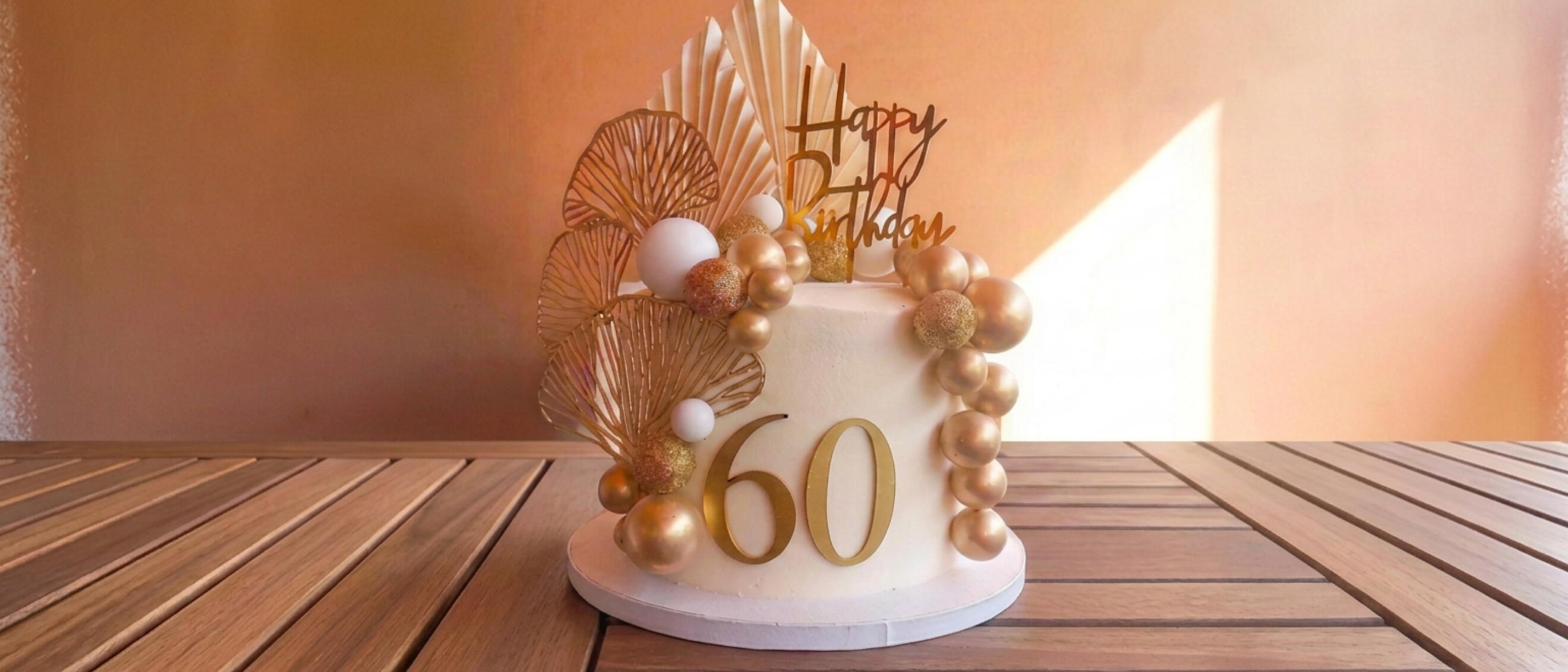 Elegant white and gold sixtieth birthday cake by Cupcake Tizzle